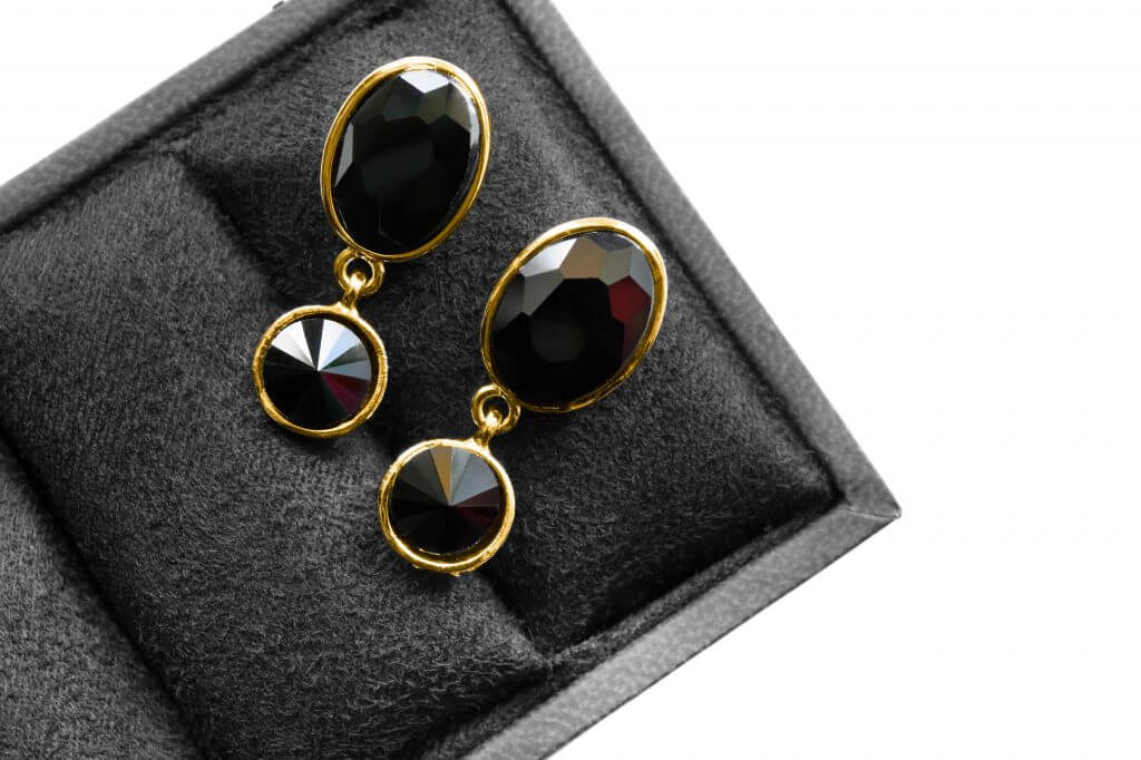 Elegant black onyx gold earrings in jewel box
